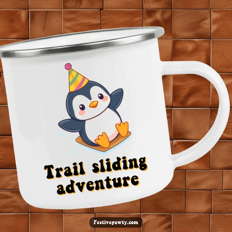 Funny camping mug featuring a playful penguin in a party hat, sliding down an icy slope, ready for adventure.