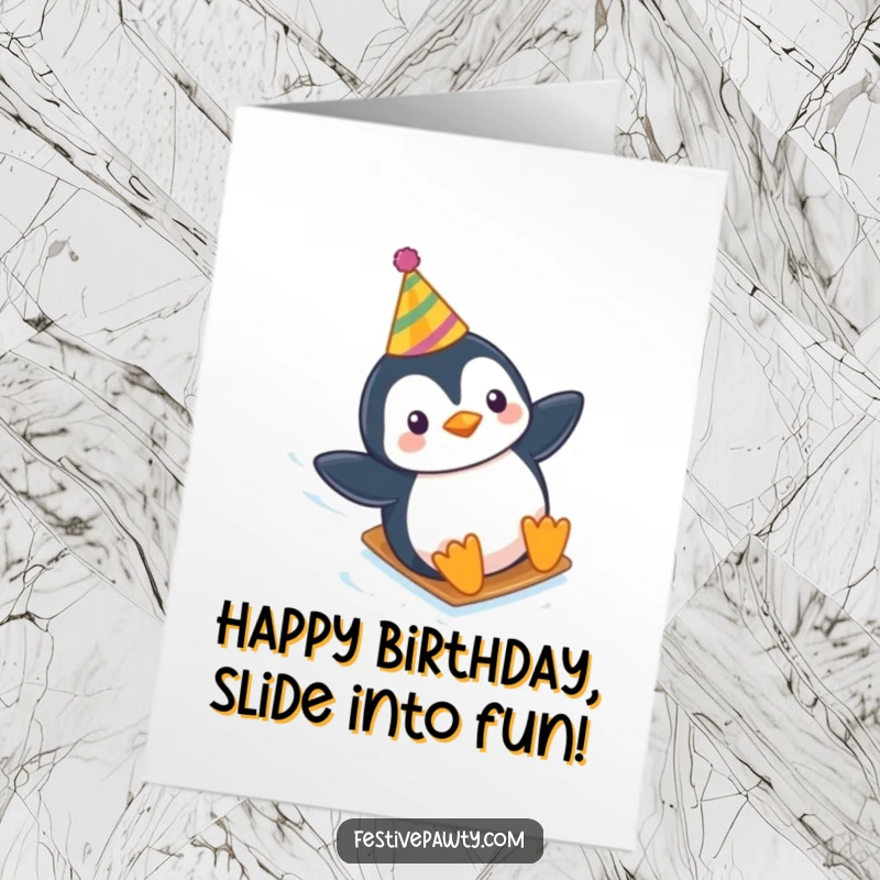 Funny Free Printable Birthday Card: A penguin in a party hat slides down an icy slope, celebrating a birthday, downloadable gift.