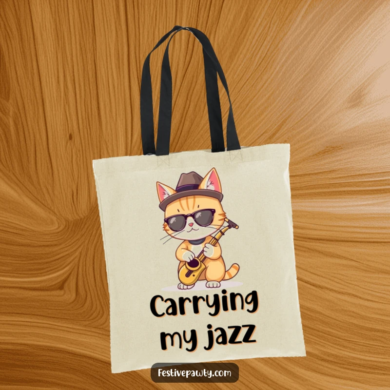Funny tote bag with a cool cat in a fedora, playing a miniature saxophone, ideal for music gifts.