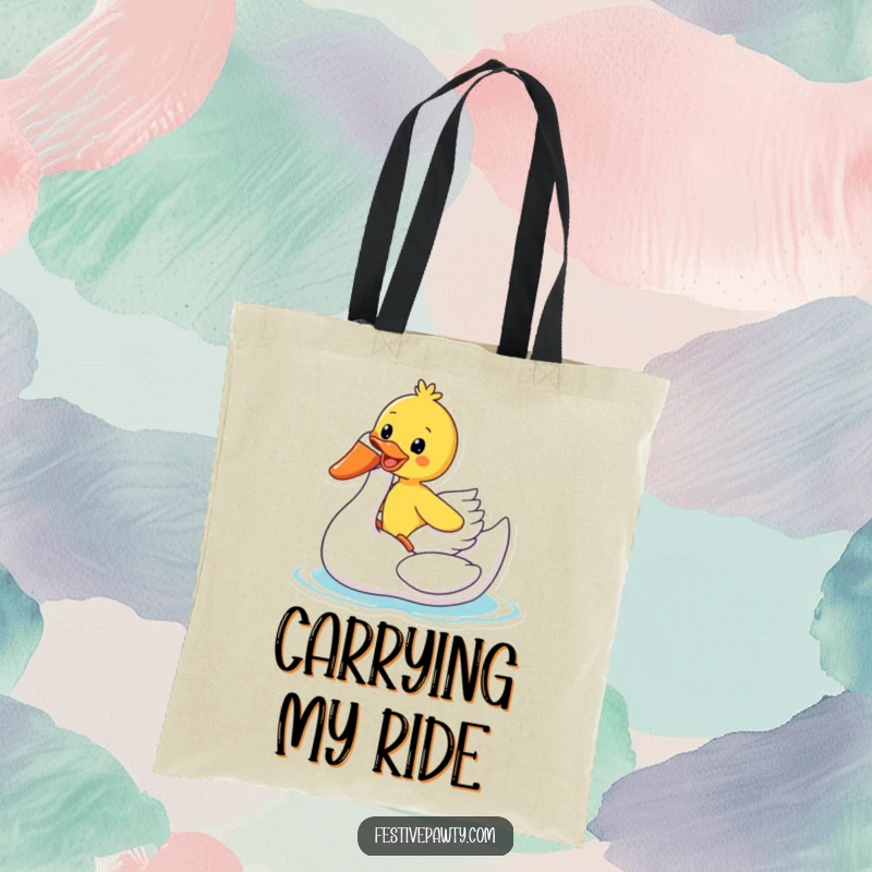 Funny Tote Bag: A gleeful duck rides an inflatable swan, perfect for carrying your items with a dose of summer humor.